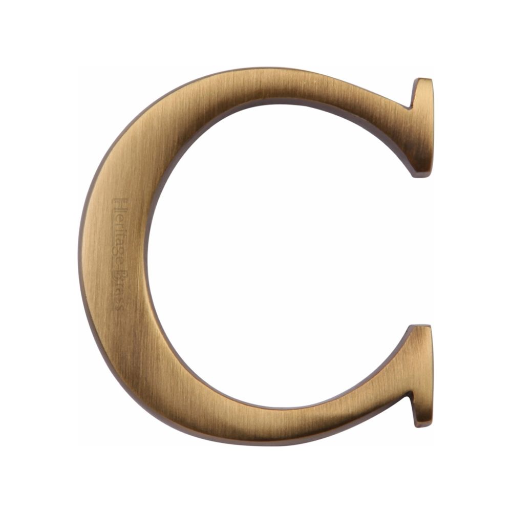 This is an image of a Heritage Brass - Alphabet C Pin Fix 51mm (2") Antique Brass Finish, c1565-2-c-at that is available to order from T.H Wiggans Ironmongery in Kendal.