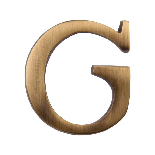 This is an image of a Heritage Brass - Alphabet G Pin Fix 51mm (2") Antique Brass Finish, c1565-2-g-at that is available to order from T.H Wiggans Ironmongery in Kendal.