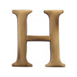 This is an image of a Heritage Brass - Alphabet H Pin Fix 51mm (2") Antique Brass Finish, c1565-2-h-at that is available to order from T.H Wiggans Ironmongery in Kendal.