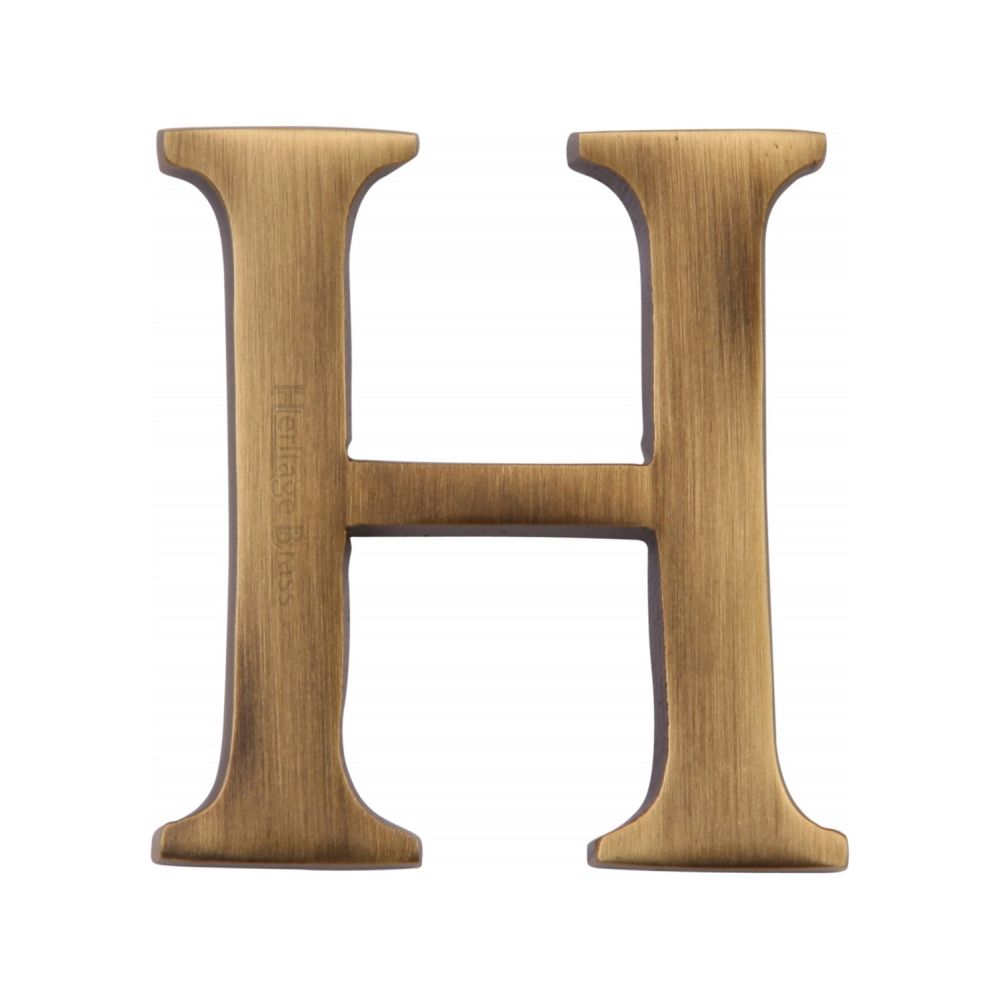 This is an image of a Heritage Brass - Alphabet H Pin Fix 51mm (2") Antique Brass Finish, c1565-2-h-at that is available to order from T.H Wiggans Ironmongery in Kendal.