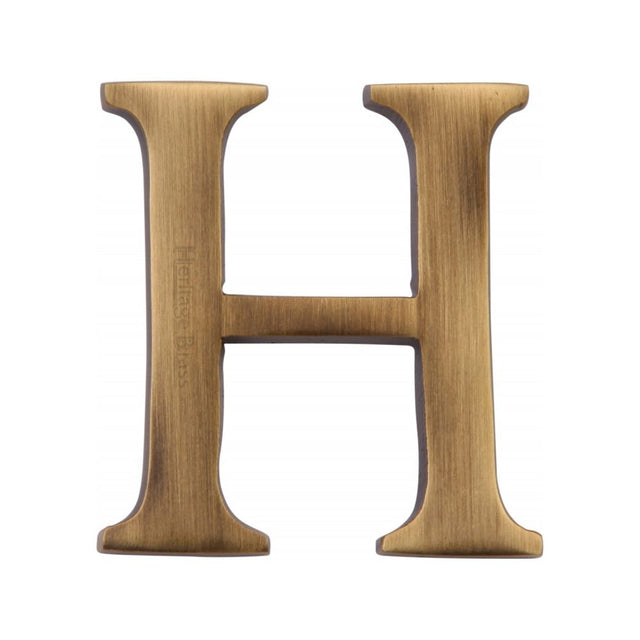This is an image of a Heritage Brass - Alphabet H Pin Fix 51mm (2") Antique Brass Finish, c1565-2-h-at that is available to order from T.H Wiggans Ironmongery in Kendal.