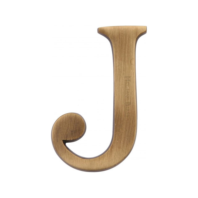 This is an image of a Heritage Brass - Alphabet J Pin Fix 51mm (2") Antique Brass Finish, c1565-2-j-at that is available to order from T.H Wiggans Ironmongery in Kendal.
