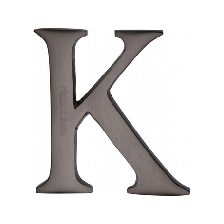This is an image of a Heritage Brass - Alphabet K Pin Fix 51mm (2") Matt Bronze Finish, c1565-2-k-mb that is available to order from T.H Wiggans Ironmongery in Kendal.