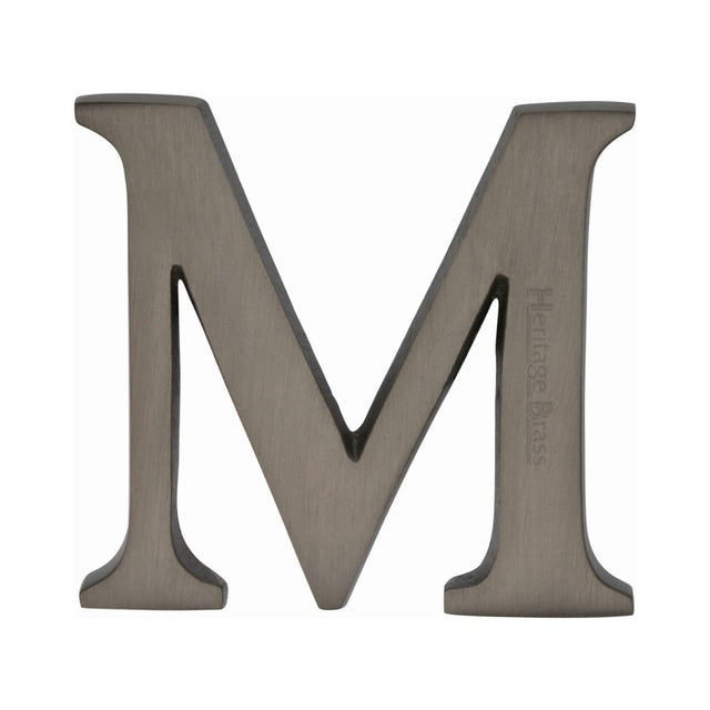 This is an image of a Heritage Brass - Alphabet M Pin Fix 51mm (2") Matt Bronze Finish, c1565-2-m-mb that is available to order from T.H Wiggans Ironmongery in Kendal.