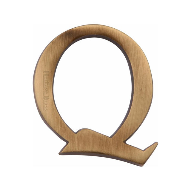 This is an image of a Heritage Brass - Alphabet Q Pin Fix 51mm (2") Antique Brass Finish, c1565-2-q-at that is available to order from T.H Wiggans Ironmongery in Kendal.