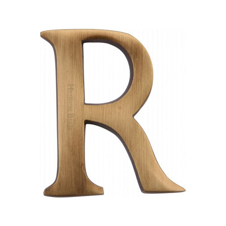 This is an image of a Heritage Brass - Alphabet R Pin Fix 51mm (2") Antique Brass Finish, c1565-2-r-at that is available to order from T.H Wiggans Ironmongery in Kendal.