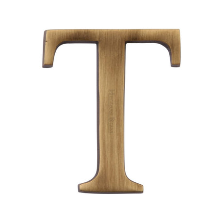 This is an image of a Heritage Brass - Alphabet T Pin Fix 51mm (2") Antique Brass Finish, c1565-2-t-at that is available to order from T.H Wiggans Ironmongery in Kendal.