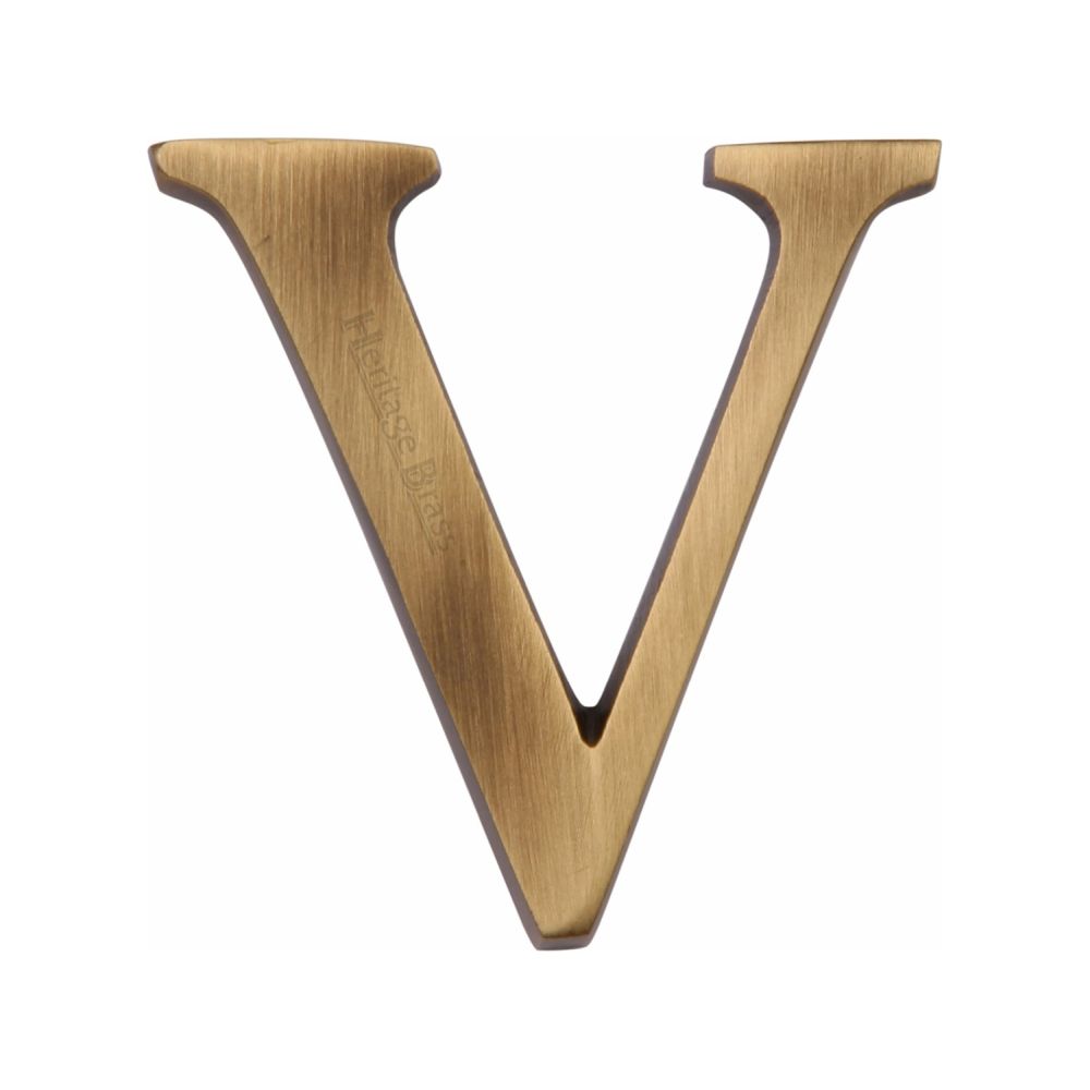 This is an image of a Heritage Brass - Alphabet V Pin Fix 51mm (2") Antique Brass Finish, c1565-2-v-at that is available to order from T.H Wiggans Ironmongery in Kendal.