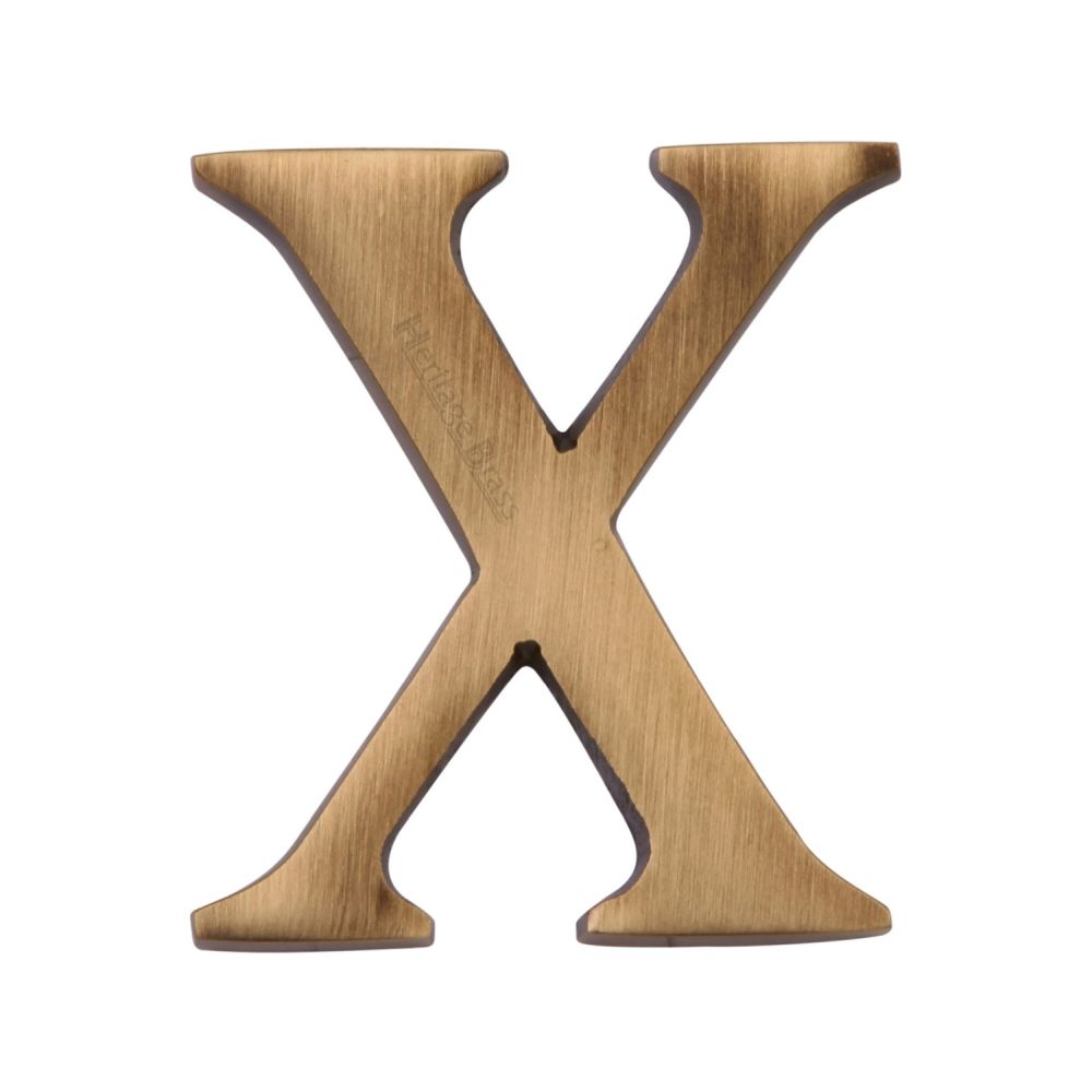 This is an image of a Heritage Brass - Alphabet X Pin Fix 51mm (2") Antique Brass Finish, c1565-2-x-at that is available to order from T.H Wiggans Ironmongery in Kendal.