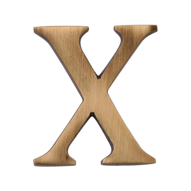 This is an image of a Heritage Brass - Alphabet X Pin Fix 51mm (2") Antique Brass Finish, c1565-2-x-at that is available to order from T.H Wiggans Ironmongery in Kendal.