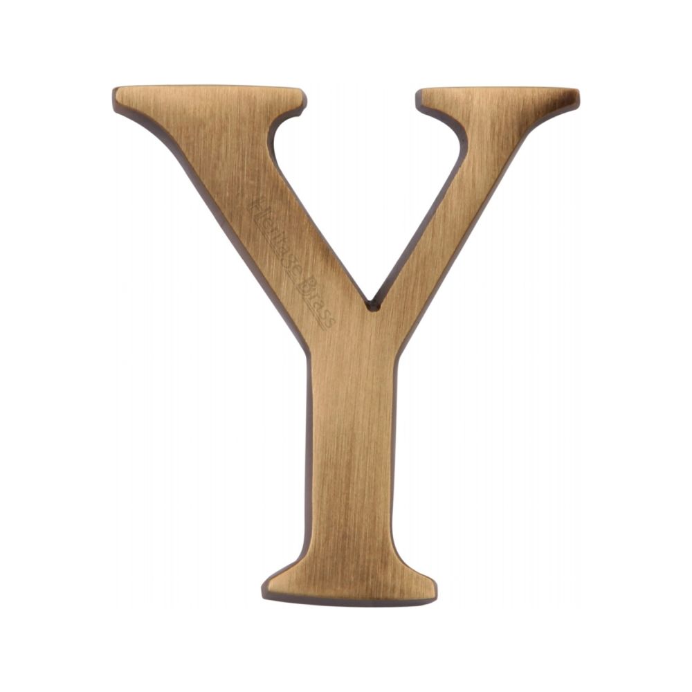 This is an image of a Heritage Brass - Alphabet Y Pin Fix 51mm (2") Antique Brass Finish, c1565-2-y-at that is available to order from T.H Wiggans Ironmongery in Kendal.