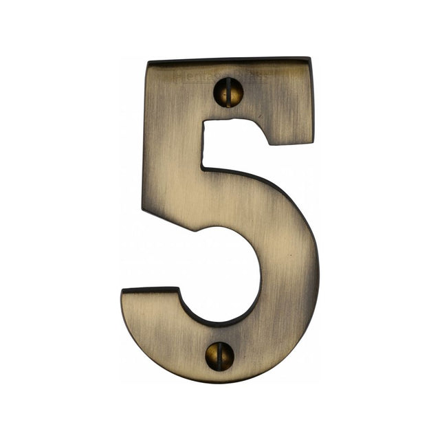 This is an image of a Heritage Brass - Numeral 5 Face Fix 76mm (3") Antique Brass Finish, c1566-5-at that is available to order from T.H Wiggans Ironmongery in Kendal.