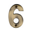 This is an image of a Heritage Brass - Numeral 6 Face Fix 76mm (3") Antique Brass Finish, c1566-6-at that is available to order from T.H Wiggans Ironmongery in Kendal.