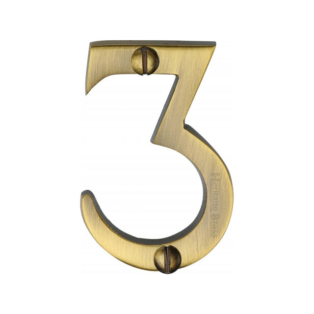 This is an image of a Heritage Brass - Numeral 3 Face Fix 51mm (2") Antique Brass Finish, c1567-3-at that is available to order from T.H Wiggans Ironmongery in Kendal.
