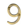 This is an image of a Heritage Brass - Numeral 9 Face Fix 51mm (2") Antique Brass Finish, c1567-9-at that is available to order from T.H Wiggans Ironmongery in Kendal.
