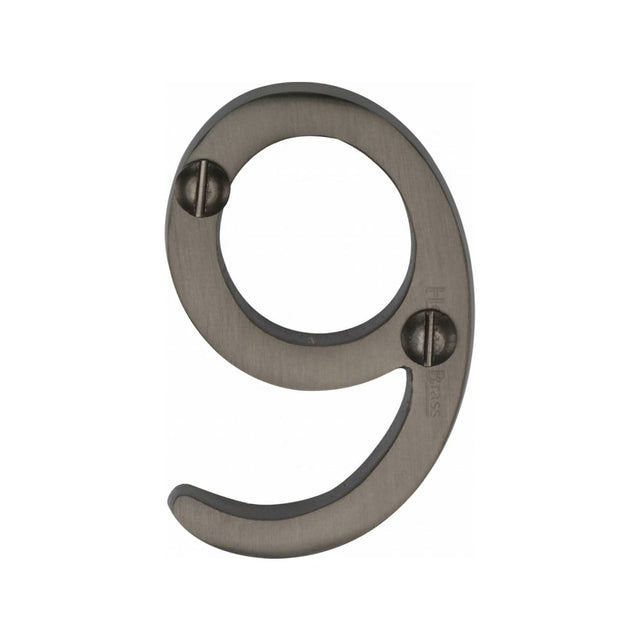 This is an image of a Heritage Brass - Numeral 9 Face Fix 51mm (2") Matt Bronze Finish, c1567-9-mb that is available to order from T.H Wiggans Ironmongery in Kendal.