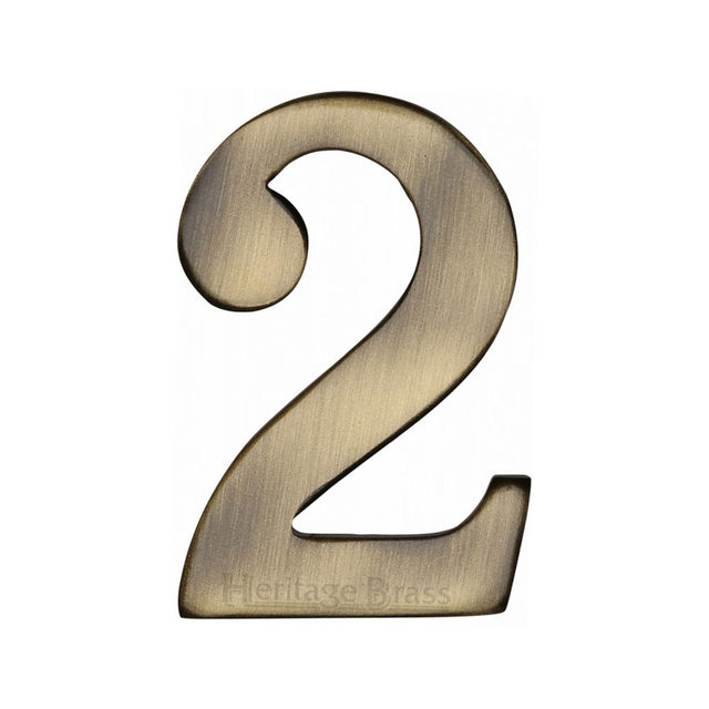 This is an image of a Heritage Brass - Numeral 2 Self Adhesive 51mm (2") Antique Brass Finish, c1568-2-at that is available to order from T.H Wiggans Ironmongery in Kendal.