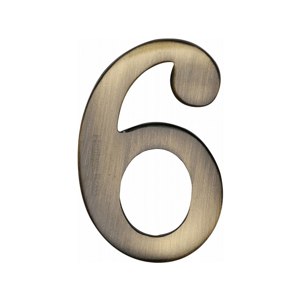 This is an image of a Heritage Brass - Numeral 6 Self Adhesive 51mm (2") Antique Brass Finish, c1568-6-at that is available to order from T.H Wiggans Ironmongery in Kendal.