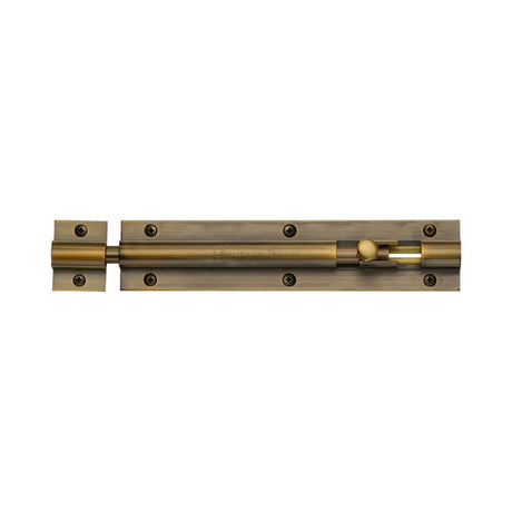 This is an image of a Heritage Brass - Door Bolt Straight 6" x 1.25" Antique Brass Finish, c1582-6-at that is available to order from T.H Wiggans Ironmongery in Kendal.