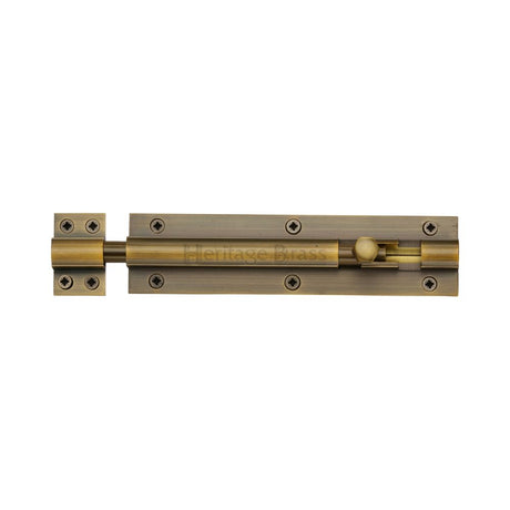 This is an image of a Heritage Brass - Door Bolt Straight 6" x 1.5" Antique Brass Finish, c1584-6-at that is available to order from T.H Wiggans Ironmongery in Kendal.