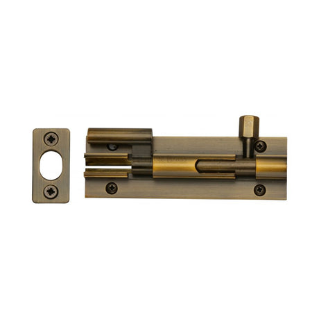 This is an image of a Heritage Brass - Door Bolt Necked 4" x 1.25" Antique Brass Finish, c1592-4-at that is available to order from T.H Wiggans Ironmongery in Kendal.