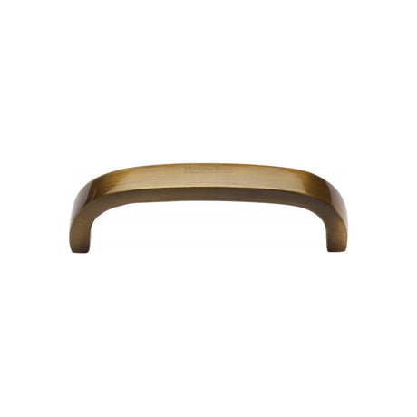 This is an image of a Heritage Brass - Cabinet Pull D Shaped 89mm CTC Antique Brass Finish, c1800-89-at that is available to order from T.H Wiggans Ironmongery in Kendal.