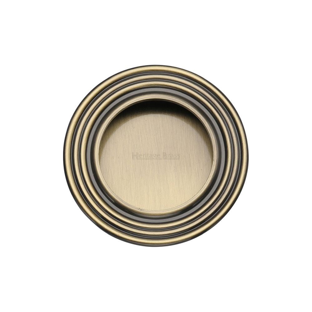 This is an image of a Heritage Brass - Round Reeded Flush Pull Antique Brass Finish, c1837-at that is available to order from T.H Wiggans Ironmongery in Kendal.