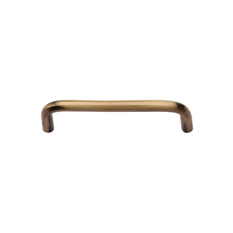 This is an image of a Heritage Brass - Cabinet Pull Wire Design 96mm CTC Antique Brass Finish, c2155-96-at that is available to order from T.H Wiggans Ironmongery in Kendal.
