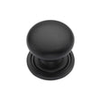 This is an image of a Heritage Brass - Cabinet Knob Victorian Round Design with base 25mm Matt Black F, c2240-25-bkmt that is available to order from T.H Wiggans Ironmongery in Kendal.