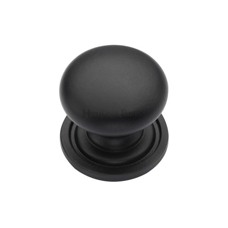 This is an image of a Heritage Brass - Cabinet Knob Victorian Round Design with base 25mm Matt Black F, c2240-25-bkmt that is available to order from T.H Wiggans Ironmongery in Kendal.