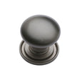 This is an image of a Heritage Brass - Cabinet Knob Victorian Round Design with base 25mm Matt Bronze, c2240-25-mb that is available to order from T.H Wiggans Ironmongery in Kendal.