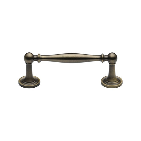 This is an image of a Heritage Brass - Cabinet Pull Colonial Design 96mm CTC Antique Brass Finish, c2533-96-at that is available to order from T.H Wiggans Ironmongery in Kendal.