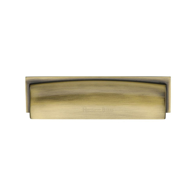 This is an image of a Heritage Brass - Drawer Cup Pull Shropshire Design 76/96mm CTC Antique Brass Finish, c2765-96-at that is available to order from T.H Wiggans Ironmongery in Kendal.