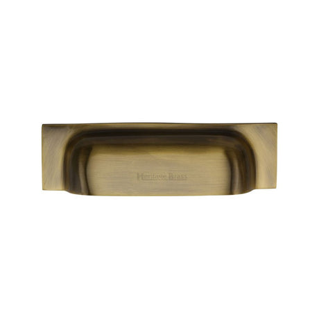 This is an image of a Heritage Brass - Drawer Cup Pull Military Design 96mm CTC Antique Brass Finish, c2766-96-at that is available to order from T.H Wiggans Ironmongery in Kendal.