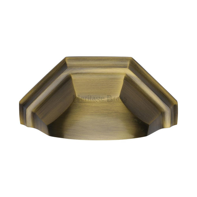 This is an image of a Heritage Brass - Drawer Cup Pull Deco Design 89mm CTC Antique Brass Finish, c2768-at that is available to order from T.H Wiggans Ironmongery in Kendal.