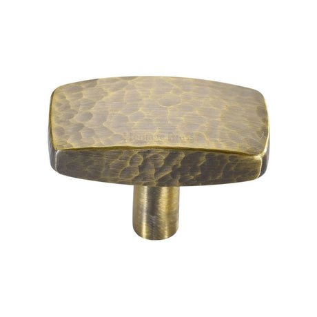 This is an image of a Heritage Brass - Cabinet Knob Rectangular Hammered Design 41mm Antique Brass Finish, c3386-41-at that is available to order from T.H Wiggans Ironmongery in Kendal.