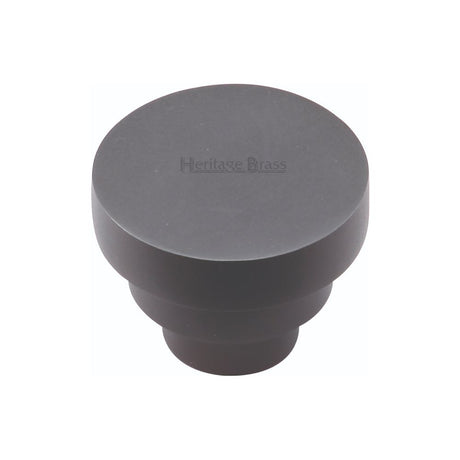 This is an image of a Heritage Brass - Cabinet Knob Round Stepped Design 32mm Matt Black Finish, c3624-32-bkmt that is available to order from T.H Wiggans Ironmongery in Kendal.