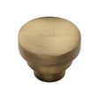 This is an image of a Heritage Brass - Cabinet Knob Round Stepped Design 38mm Antique Brass Finish, c3624-38-at that is available to order from T.H Wiggans Ironmongery in Kendal.