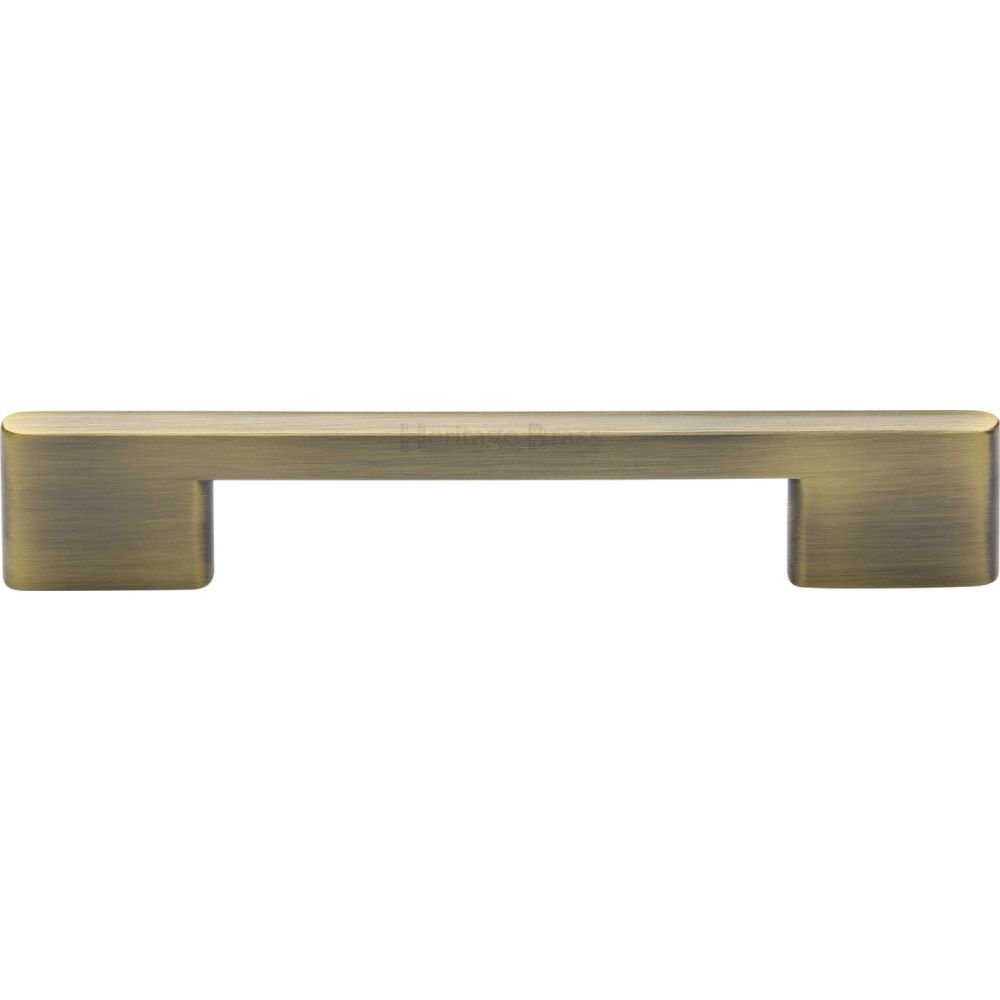 This is an image of a Heritage Brass - Cabinet Pull Slim Metro Design 128mm CTC Antique Brass Finish, c3681-128-at that is available to order from T.H Wiggans Ironmongery in Kendal.