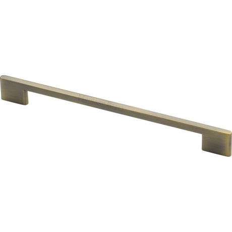 This is an image of a Heritage Brass - Cabinet Pull Slim Metro Design 256mm CTC Antique Brass Finish, c3681-256-at that is available to order from T.H Wiggans Ironmongery in Kendal.
