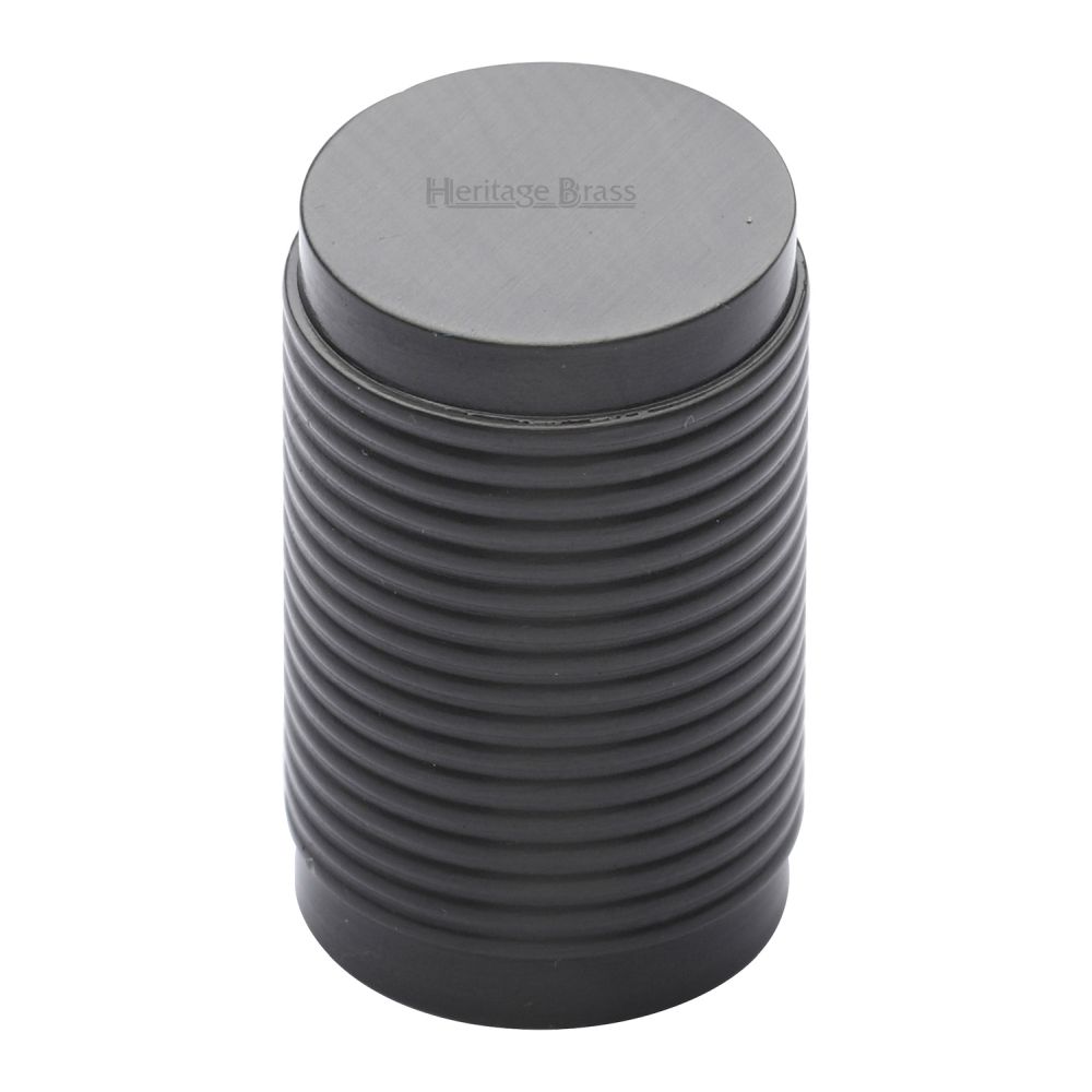 This is an image of a Heritage Brass - Cabinet Knob Cylindric Ribbed Design 21mm Matt Bronze Finish, c3850-mb that is available to order from T.H Wiggans Ironmongery in Kendal.
