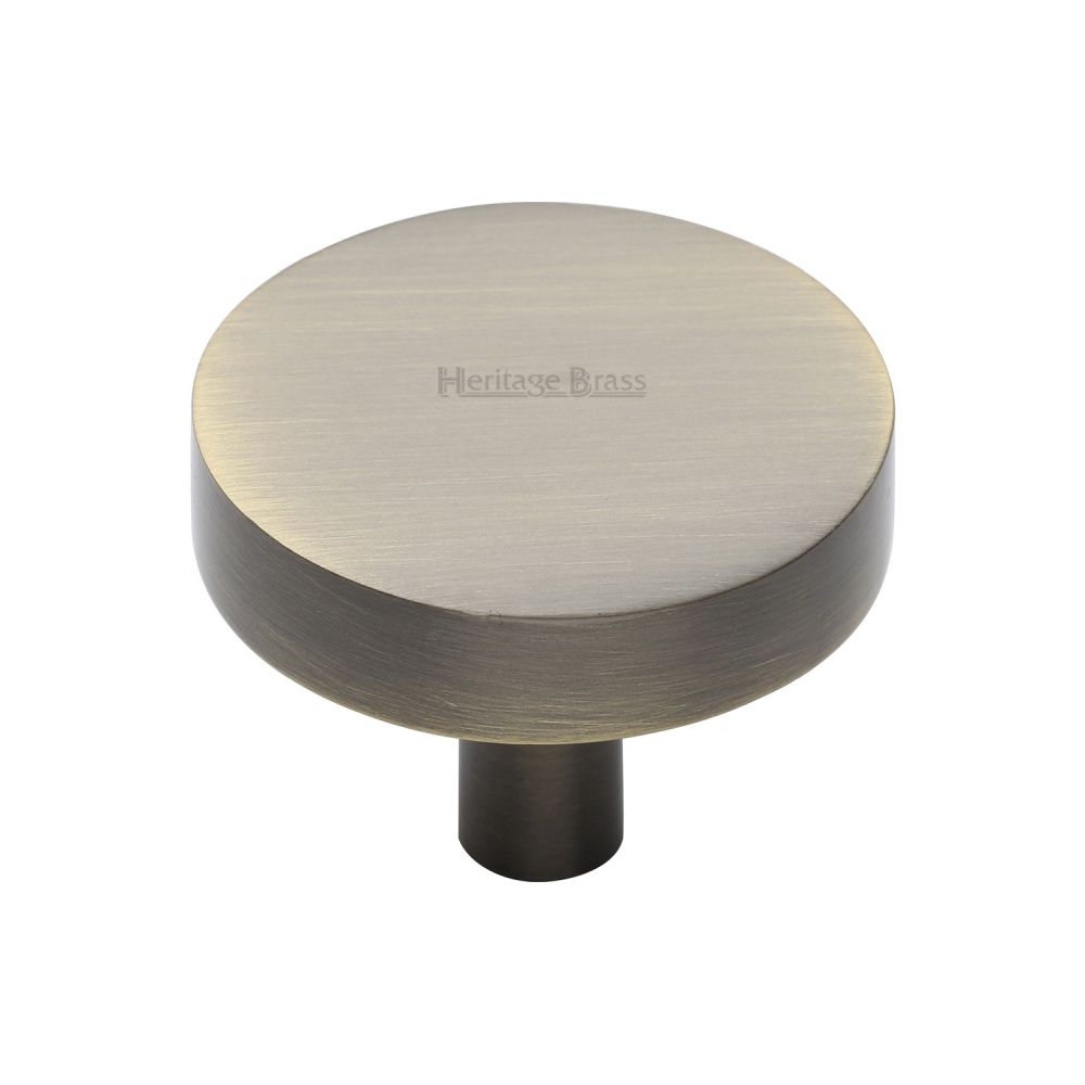 This is an image of a Heritage Brass - Cabinet Knob Disc Design 38mm Antique Brass Finish, c3880-38-at that is available to order from T.H Wiggans Ironmongery in Kendal.