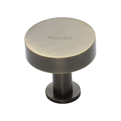 This is an image of a Heritage Brass - Cabinet Knob Disc Design with Rose 32mm Antique Brass Finish, c3885-32-at that is available to order from T.H Wiggans Ironmongery in Kendal.