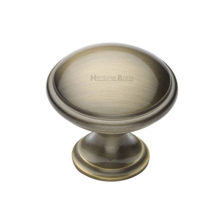 This is an image of a Heritage Brass - Cabinet Knob Domed Design 32mm Antique Brass Finish, c3950-32-at that is available to order from T.H Wiggans Ironmongery in Kendal.