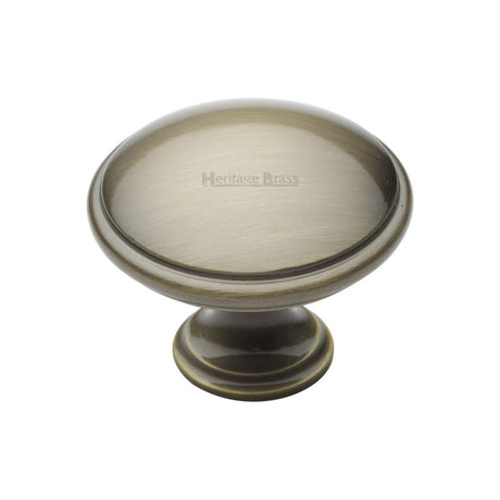 This is an image of a Heritage Brass - Cabinet Knob Domed Design 38mm Antique Brass Finish, c3950-38-at that is available to order from T.H Wiggans Ironmongery in Kendal.
