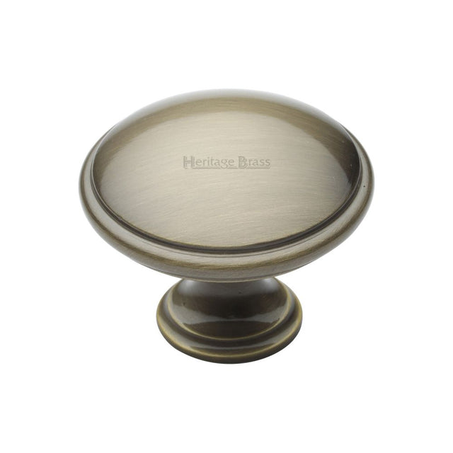 This is an image of a Heritage Brass - Cabinet Knob Domed Design 38mm Antique Brass Finish, c3950-38-at that is available to order from T.H Wiggans Ironmongery in Kendal.