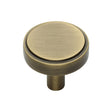 This is an image of a Heritage Brass - Cabinet Knob Stepped Disc Design 32mm Antique Brass Finish, c3952-32-at that is available to order from T.H Wiggans Ironmongery in Kendal.