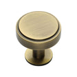 This is an image of a Heritage Brass - Cabinet Knob Stepped Disc Design with Rose 32mm Antique Brass Fini, c3954-32-at that is available to order from T.H Wiggans Ironmongery in Kendal.