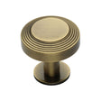 This is an image of a Heritage Brass - Cabinet Knob Ridge Design with Rose 32mm Antique Brass Finish, c3958-32-at that is available to order from T.H Wiggans Ironmongery in Kendal.