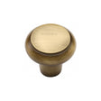 This is an image of a Heritage Brass - Cabinet Knob Round Edge Design 32mm Antique Brass Finish, c3990-32-at that is available to order from T.H Wiggans Ironmongery in Kendal.
